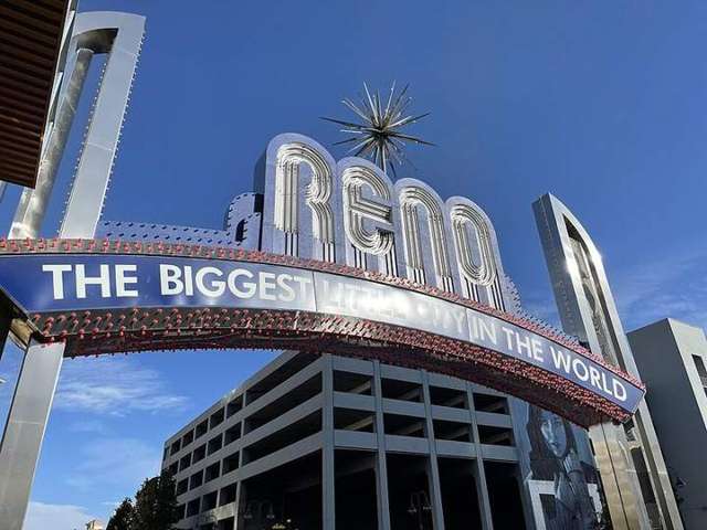 The Reno Arch, lit at dusk